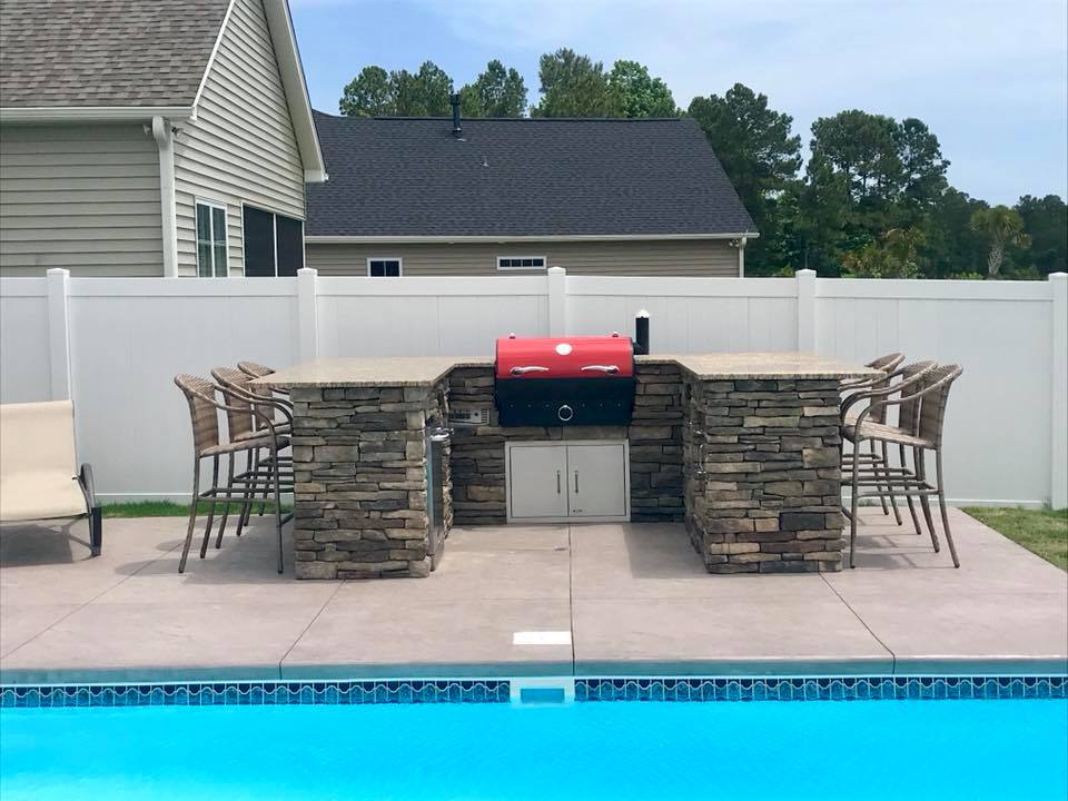 Outdoor kitchen by pool