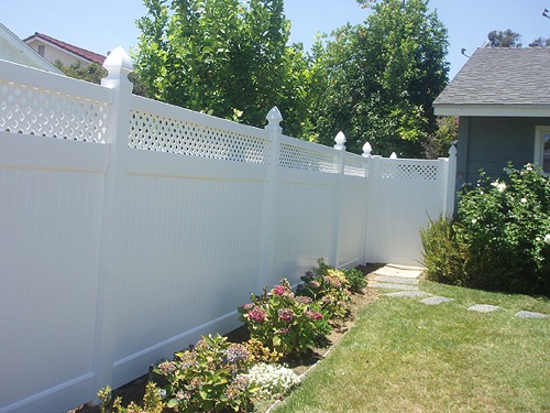 White privacy fence in backyard
