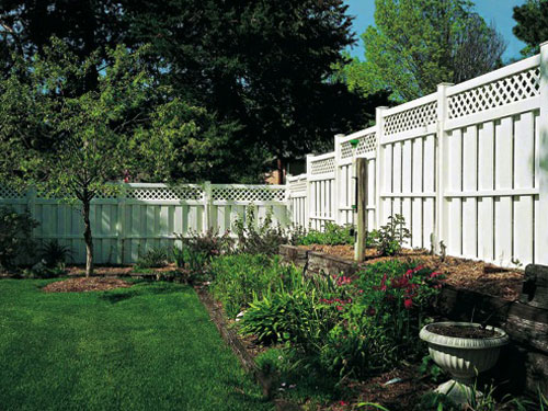 White privacy fence in garden