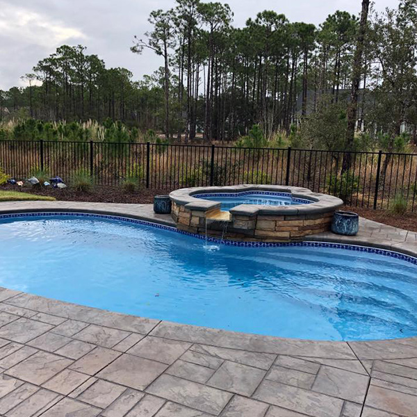 Outdoor spa next to pool